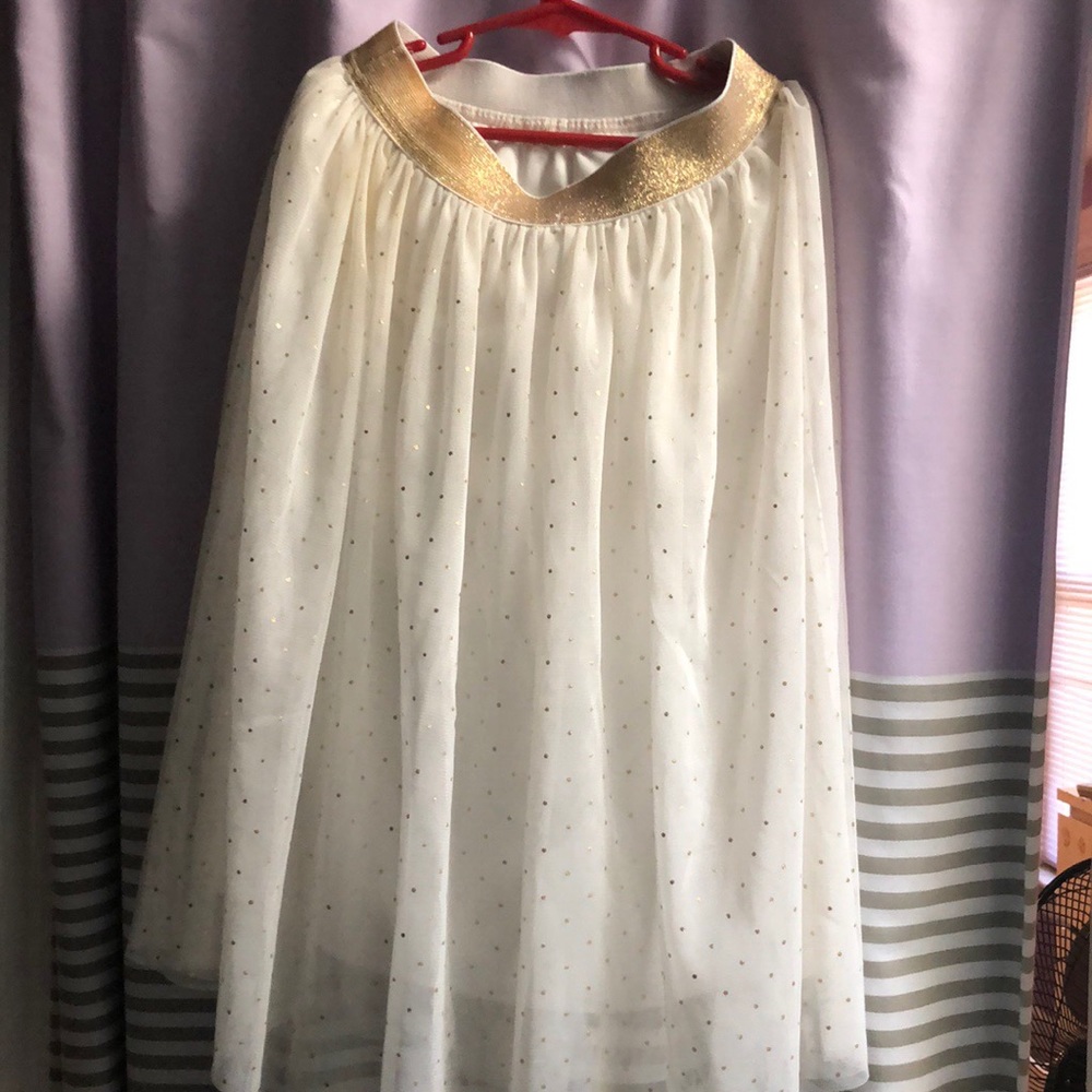 A Golden And White Skirt